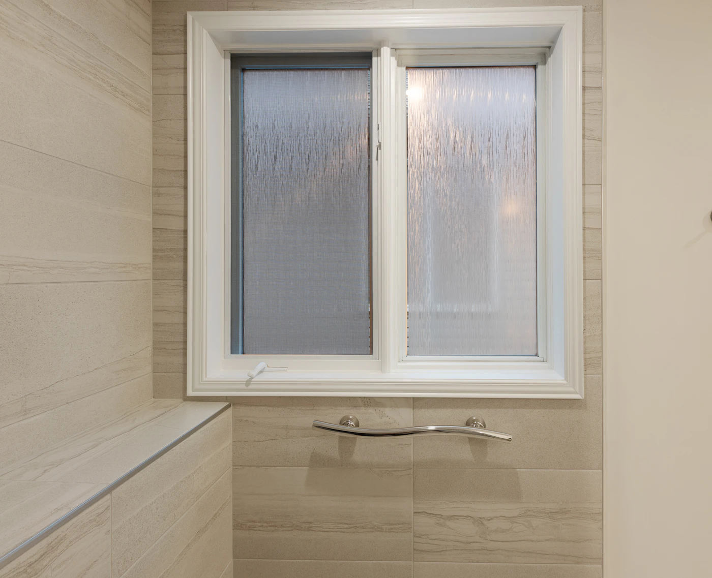 A frosted bathroom window letting the daylight in and nothing else